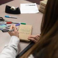 Participants helped decorate wrapped books.